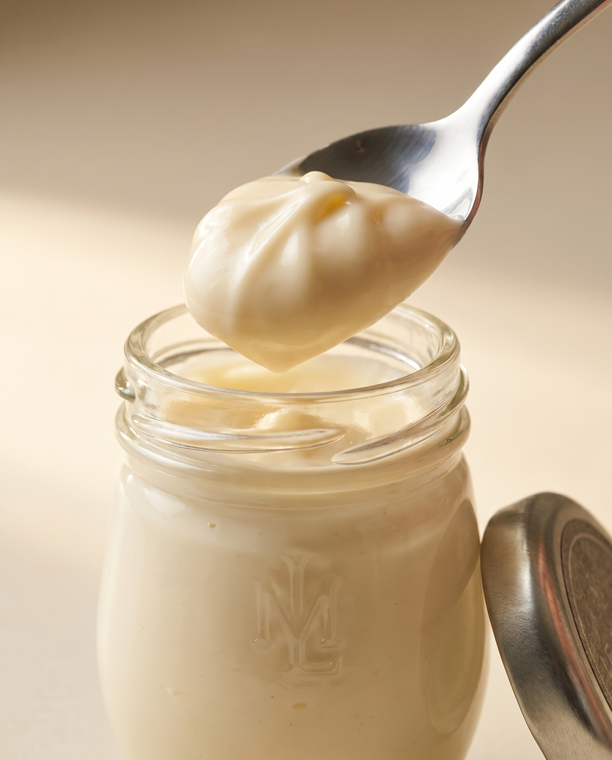Le Must Deluxe Organic Mayonnaise, 44 grams, with a spoon