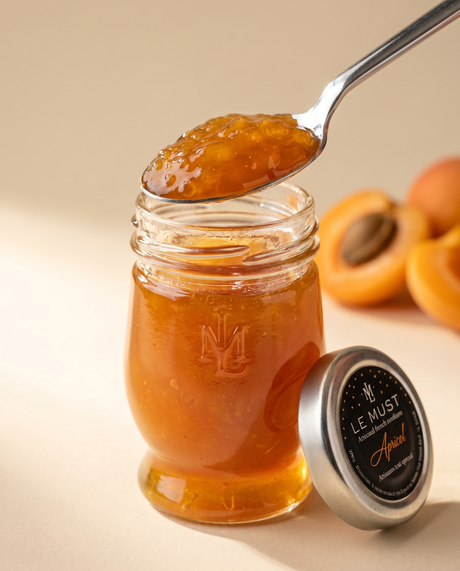 Le Must Deluxe Organic Apricot Jam, 45 grams, with a spoon