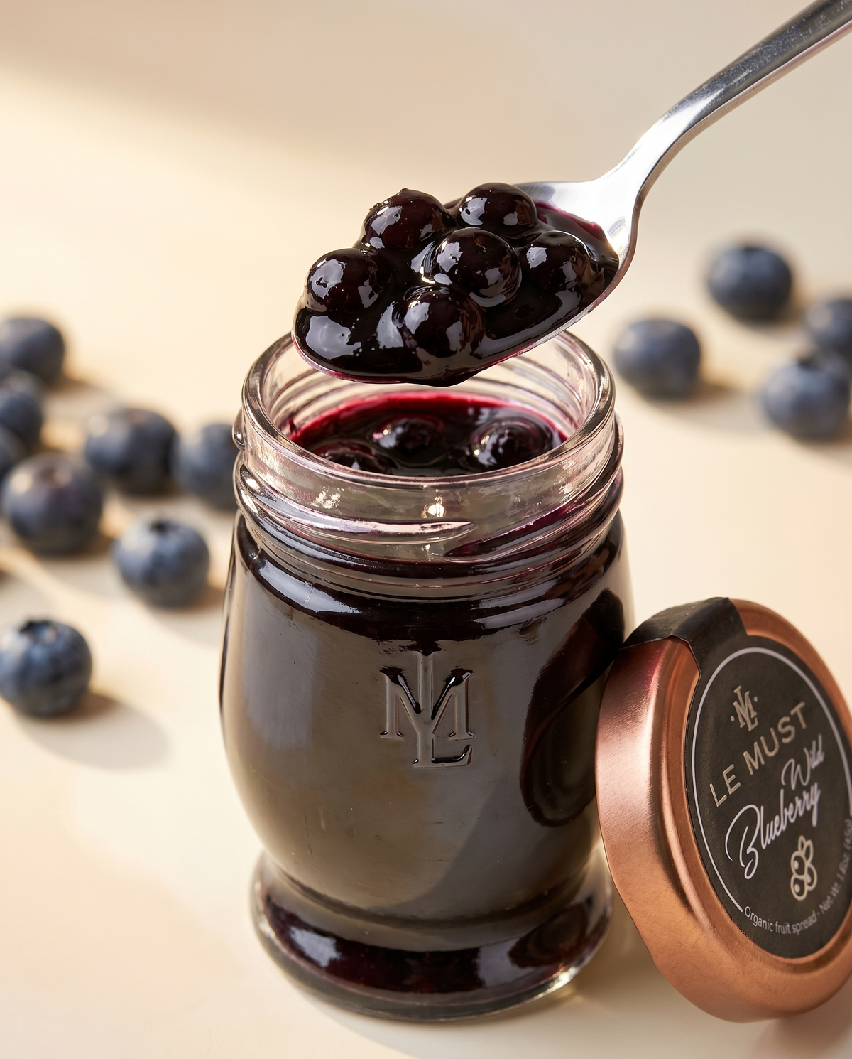 Le Must Deluxe Organic Wild Blueberry Jam, 45 grams, with a spoon