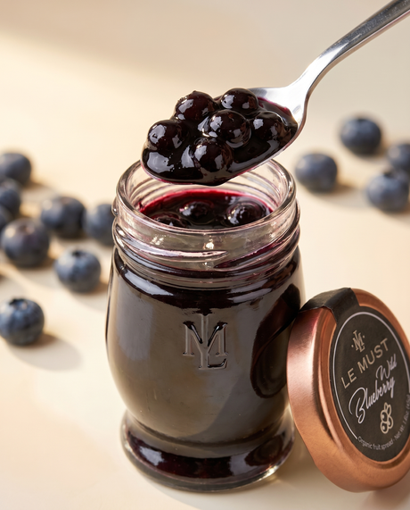 Le Must Deluxe Organic Wild Blueberry Jam, 45 grams, with a spoon