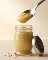 Le Must Deluxe Organic Dijon Mustard, 48 grams, with a spoon