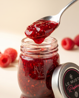 Le Must Deluxe Organic Raspberry Jam, 45 grams, with a spoon