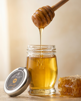 Le Must Deluxe Wildflower Honey, 55 grams, with a honey dipper