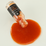 Le Must Pequin Hot Sauce, 15 ml, poured sauce