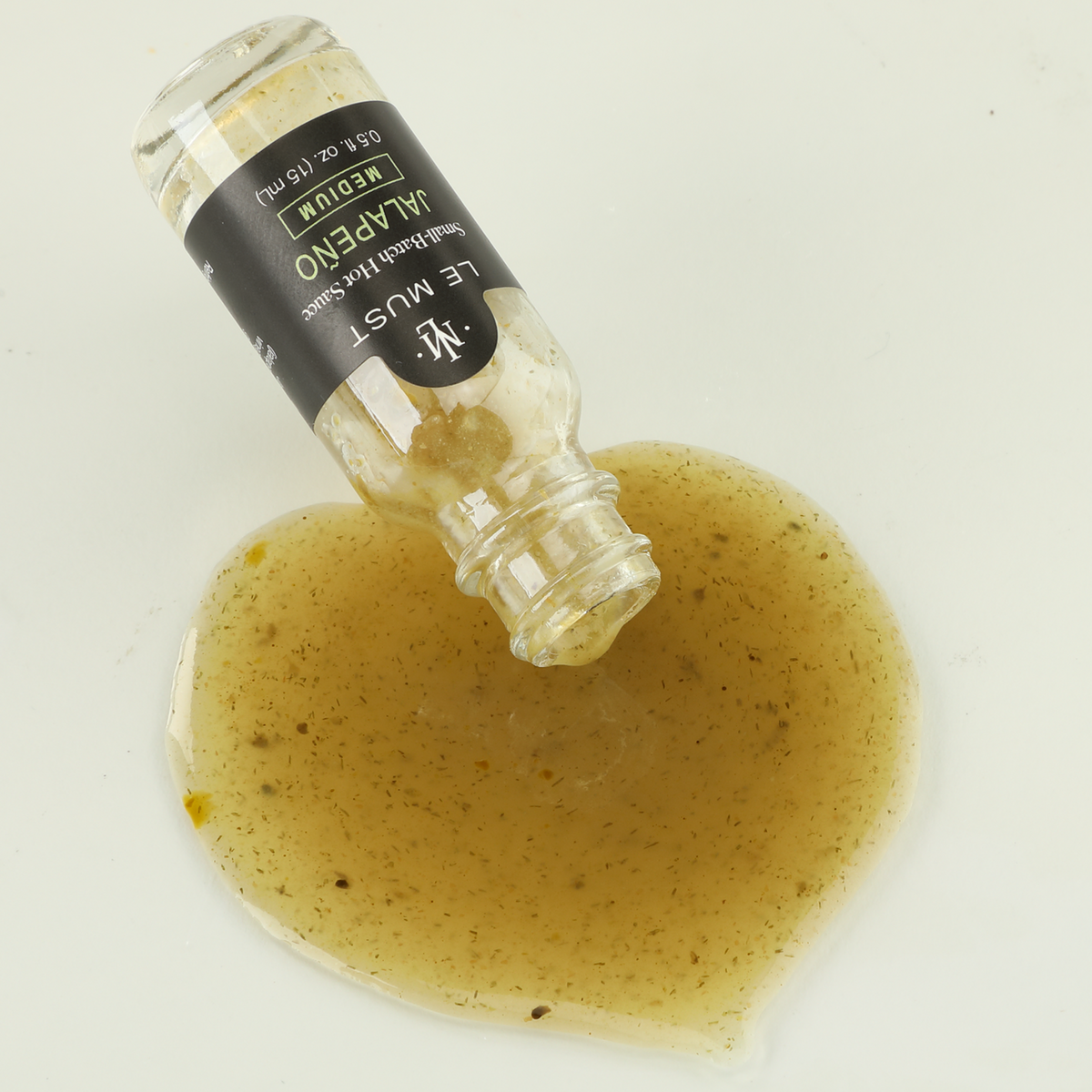 Le Must Jalapeño Hot Sauce, 15 ml, poured sauce