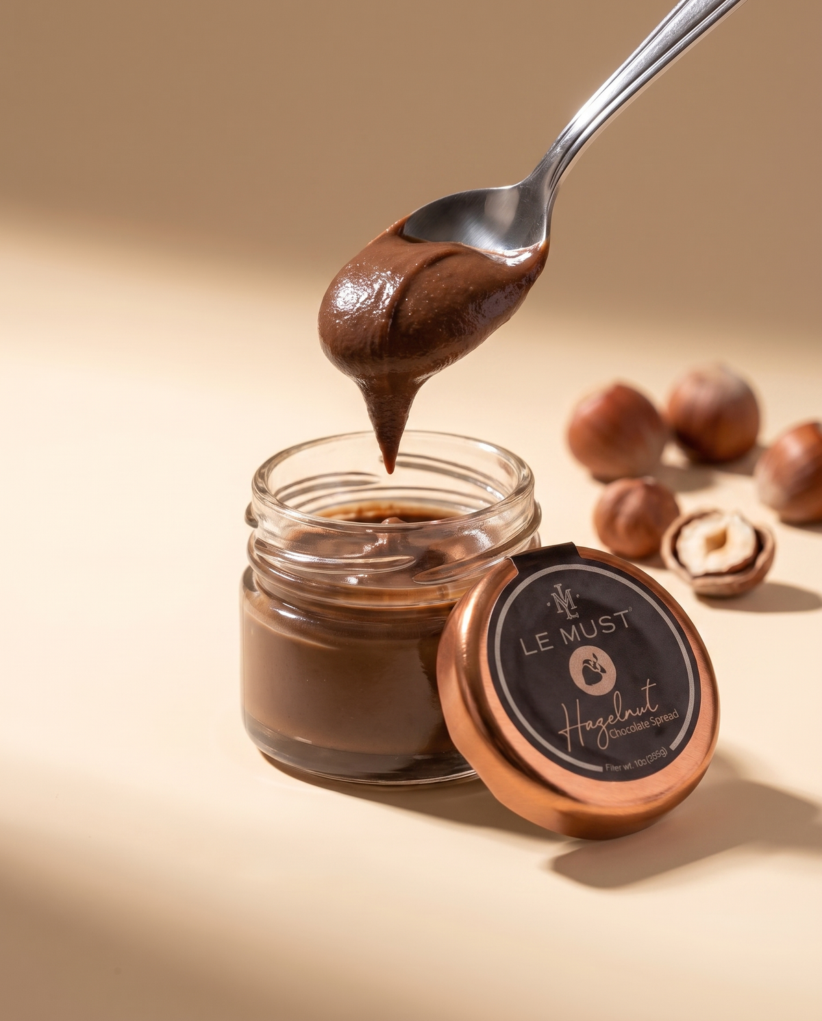 Le Must Premium Chocolate Hazelnut Spread, 28 grams, open jar